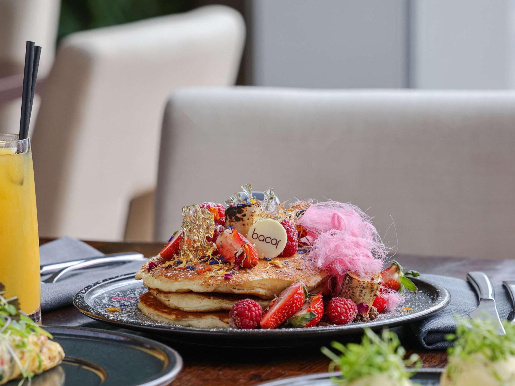 Pullman Sydney Olympic Park Hotel Bagian luar foto A stack of pancakes with fruit