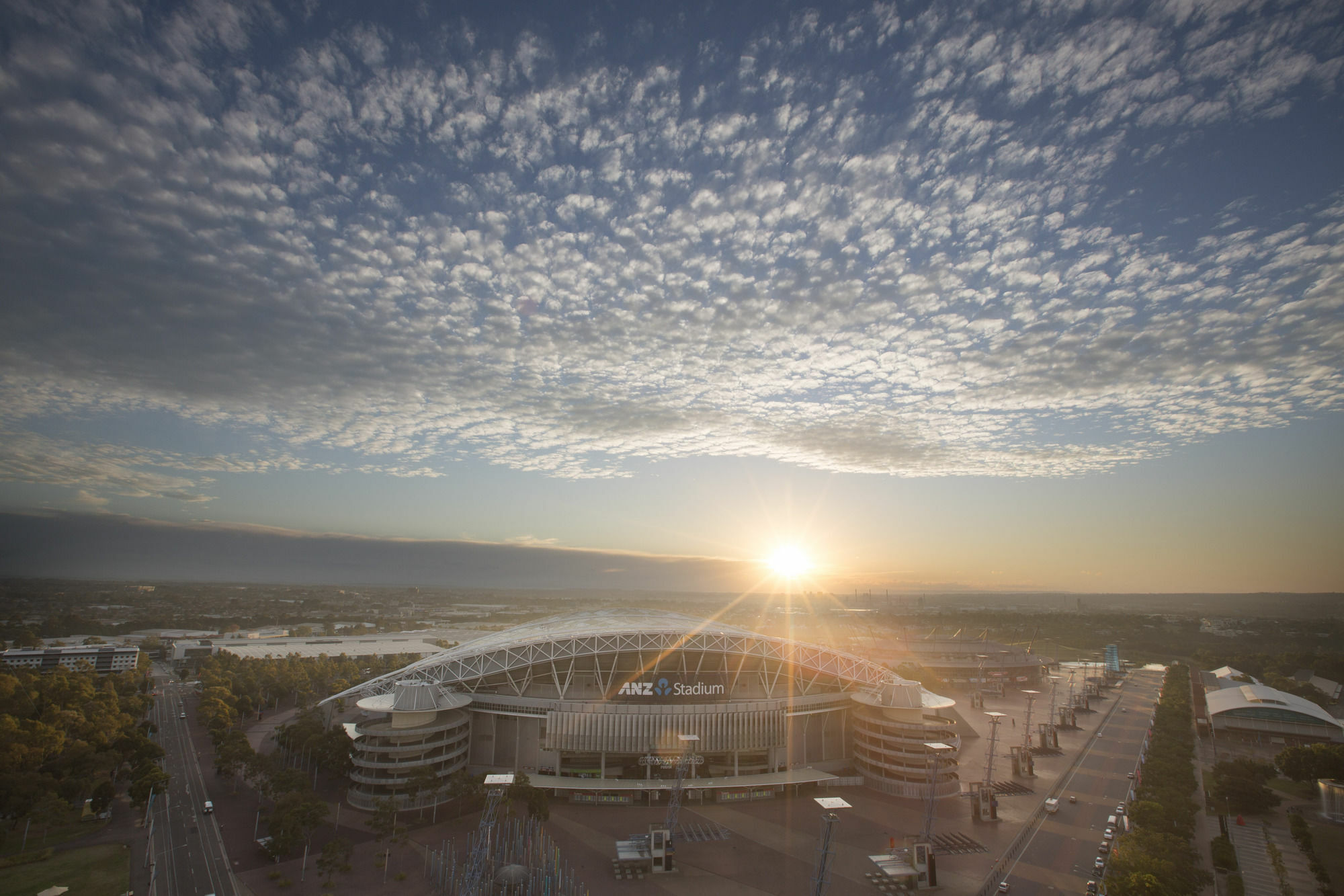 Pullman Sydney Olympic Park Hotel Bagian luar foto The stadium at sunset